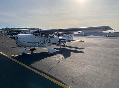 Cessna 172 G1000 N6137Q parked on the ramp with the sun low behind it